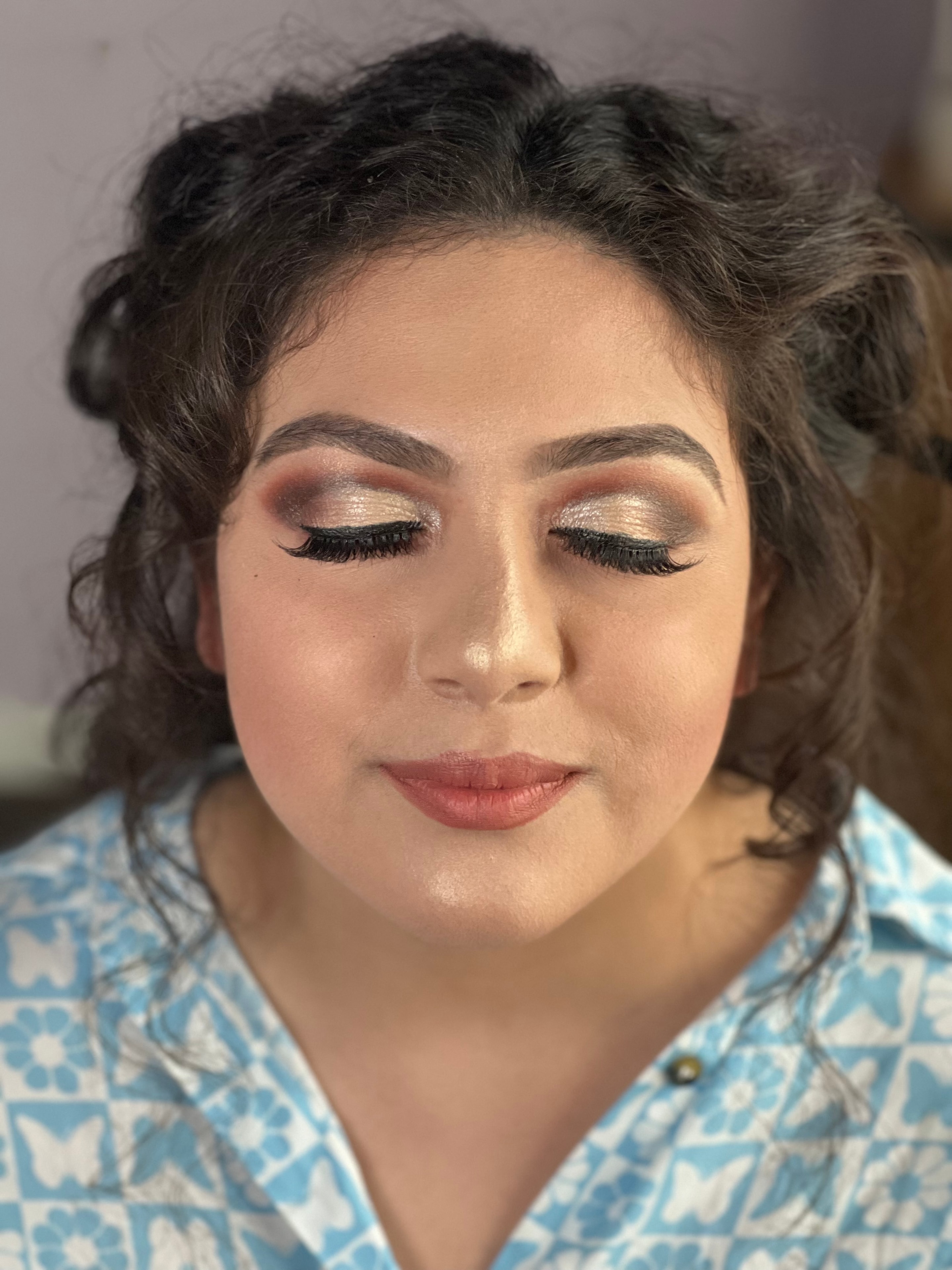 Glam makeup look with shimmer eyeshadow and lashes